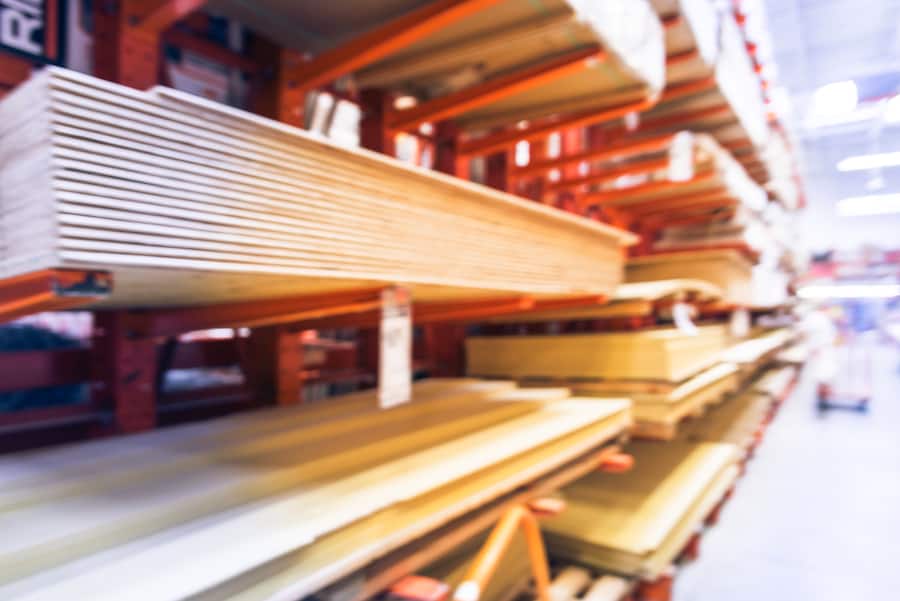 Blurred Wooden Bars From Floor To Ceiling At Lumber Yard Of Hardware Store