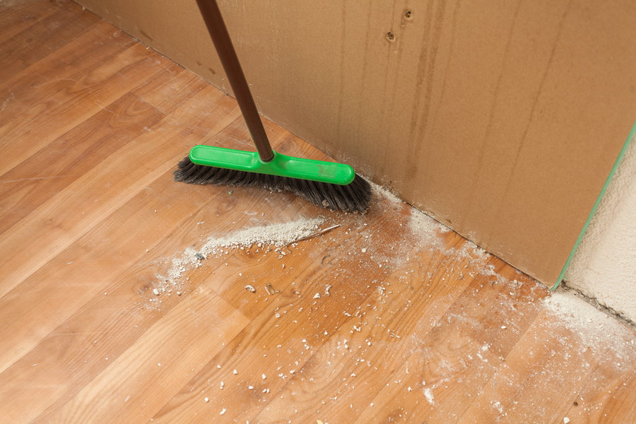 Cleaning Debris On The Floor By Brush