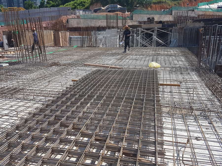 Construction Workers Fabricating The Timber Formwork And Installing The Steel Reinforcement Bar