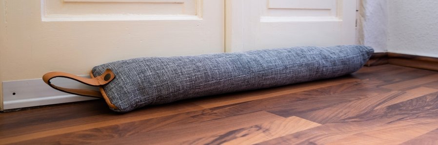 Draft Excluder Under Door Blocking Cold Air From Traveling Around