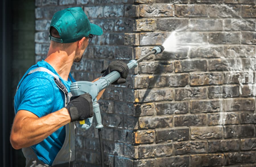 House Brick Wall Washing Using Pressure Washer