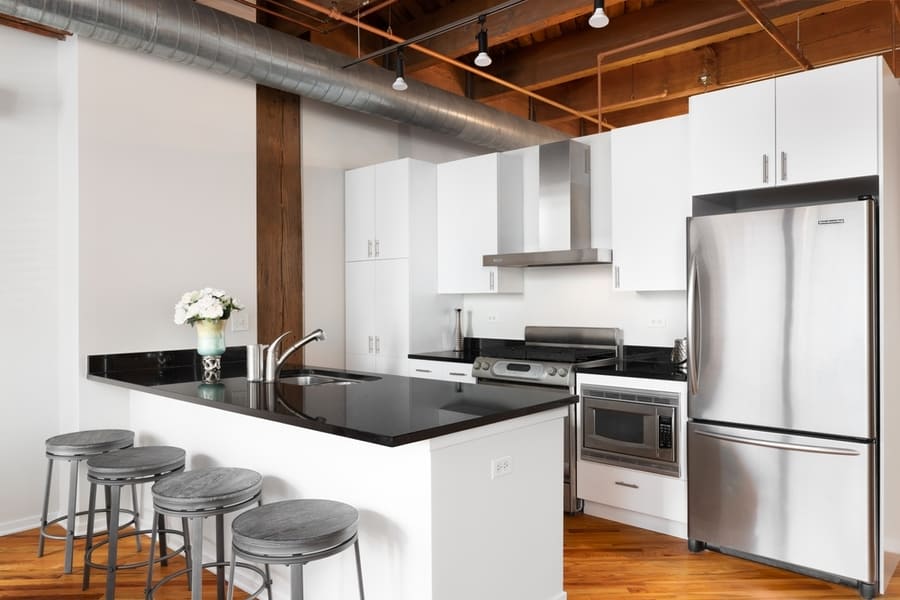 Kitchen In A Home With A Wood Beam Ceiling