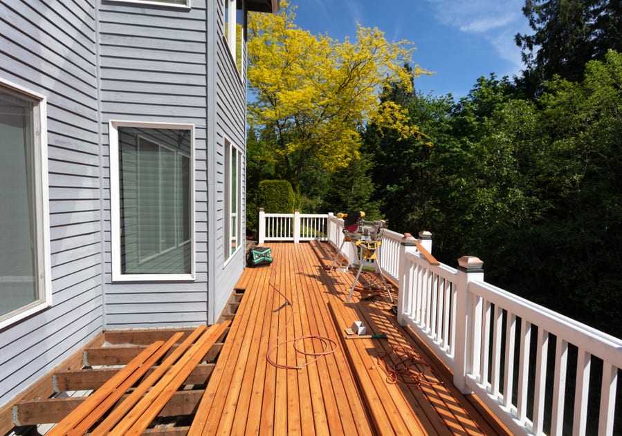 Outdoor Wooden Deck Being Remodeled With New Red Cedar Wood Floor Boards