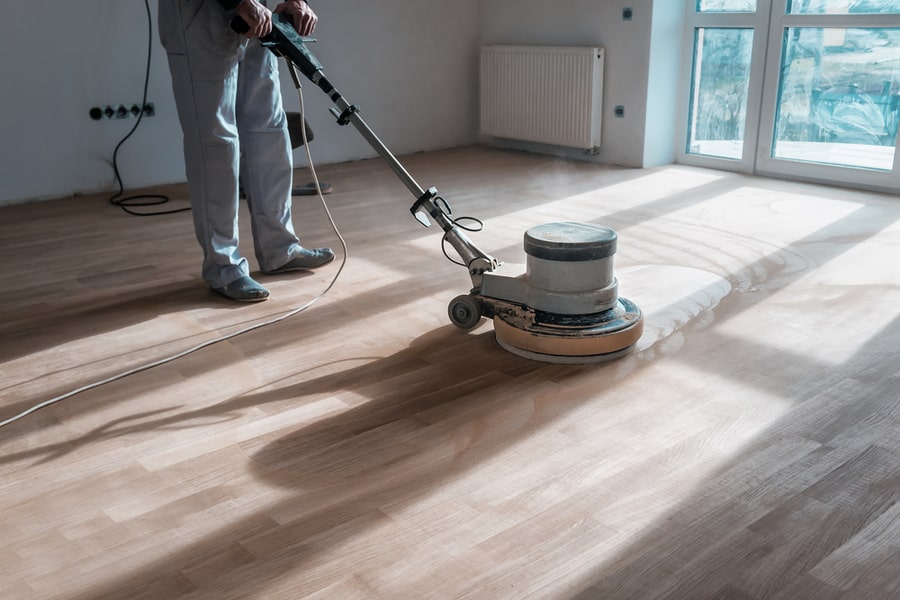 Professional Master Cleans Floor Parquet
