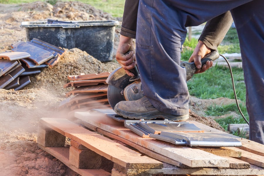 Worker Using Hand Circular Saw