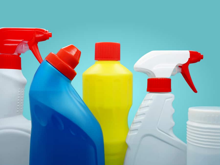 Chlorine Cleaner Plastic Bottles On Colored Background