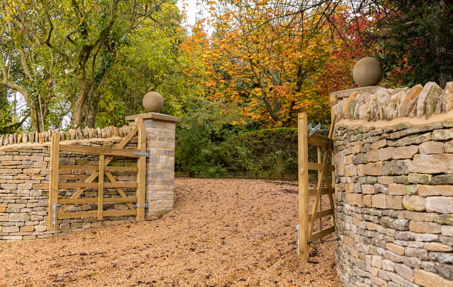 Gravel Driveway With Low Wall