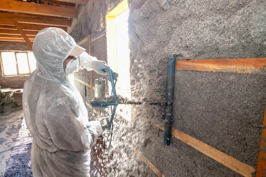 Leveling The Wall After Applying Cellulose Insulation To It