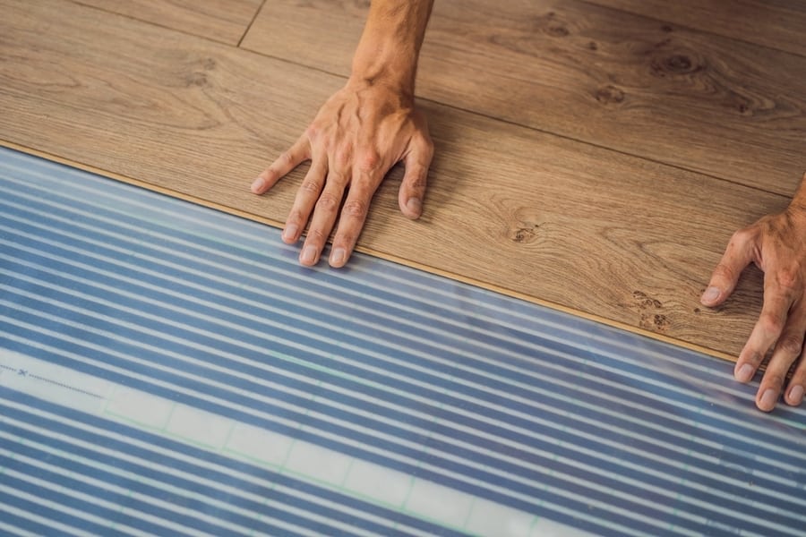 Man Installing New Wooden Laminate Flooring