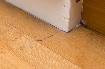 Picture Showing A Crack In Vinyl Flooring That Needs Repairing.