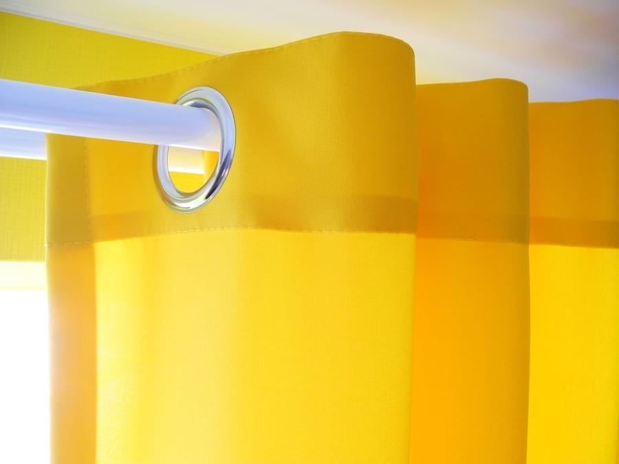 Sunny Yellow Curtain With Grommets Or Eyelets Close-Up, Modern Interior Design In Vibrant Colors