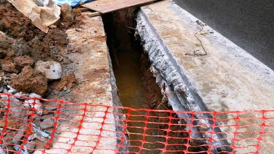 A Trench Has Been Created To A Specified Dimension Using A Diamond Saw Machine And A Mini Excavator To Cut, Hack And Remove Concrete And Soil. This Is To Make Space For Sewage Pipe Laying.