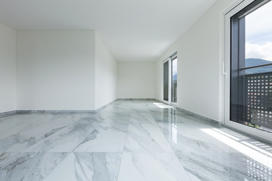 An Empty Apartment With Tile Flooring