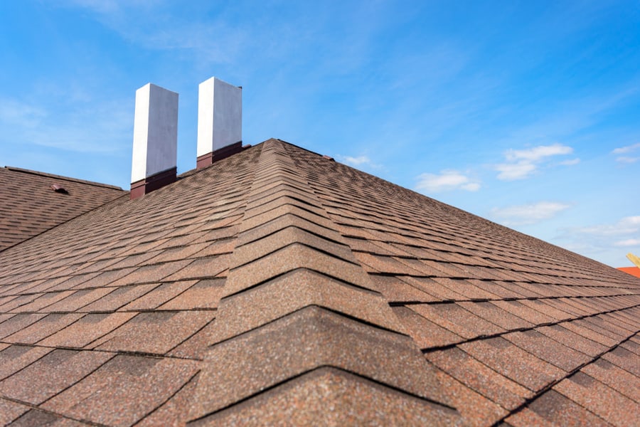 Photo Of New Roof With Asphalt Tile And Two White Chimney