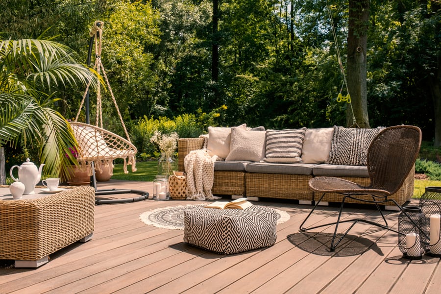 A Table And A Chair On A Wooden Deck