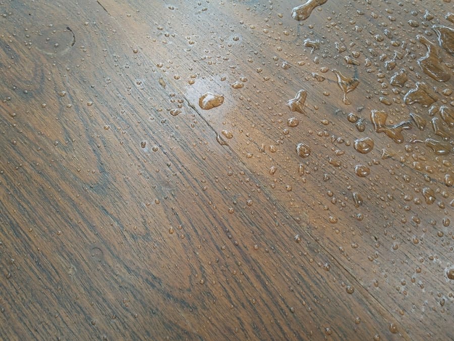 Background Of Water Drops On The Wooden Floor