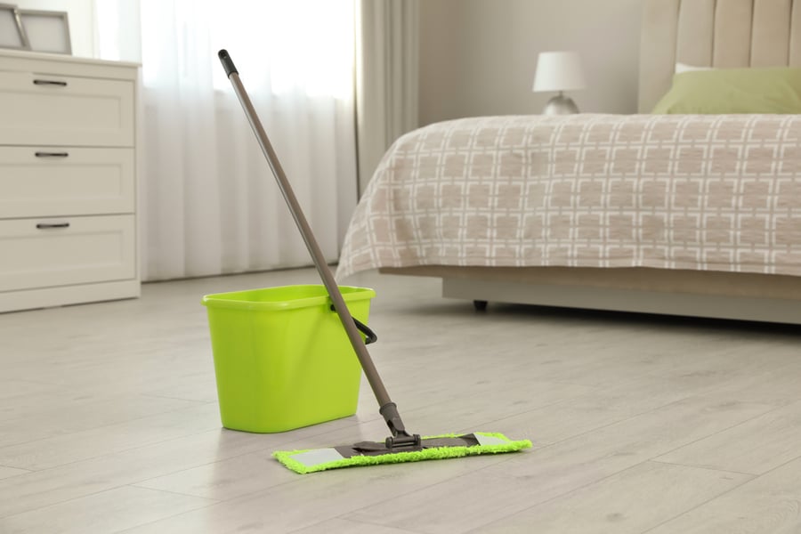 Bucket And Mop On Floor At Home