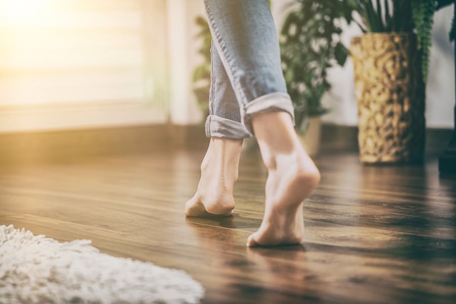 Woman Walking In The House On The Clean Floor